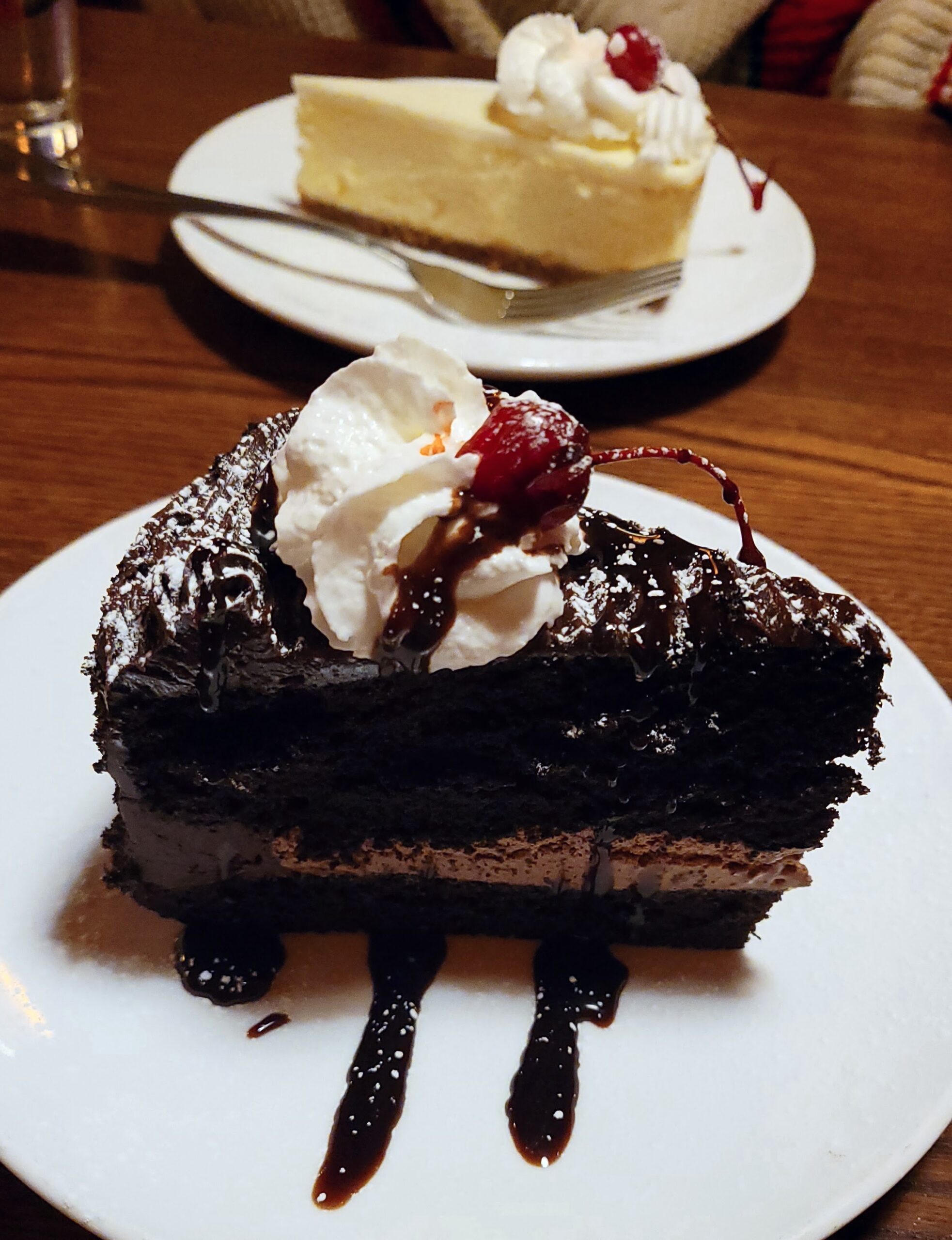 Chocolate mousse cake topped with whipped cream and a red cherry at the Barking Dog.